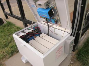 Solar powered bus stop battery box and controls